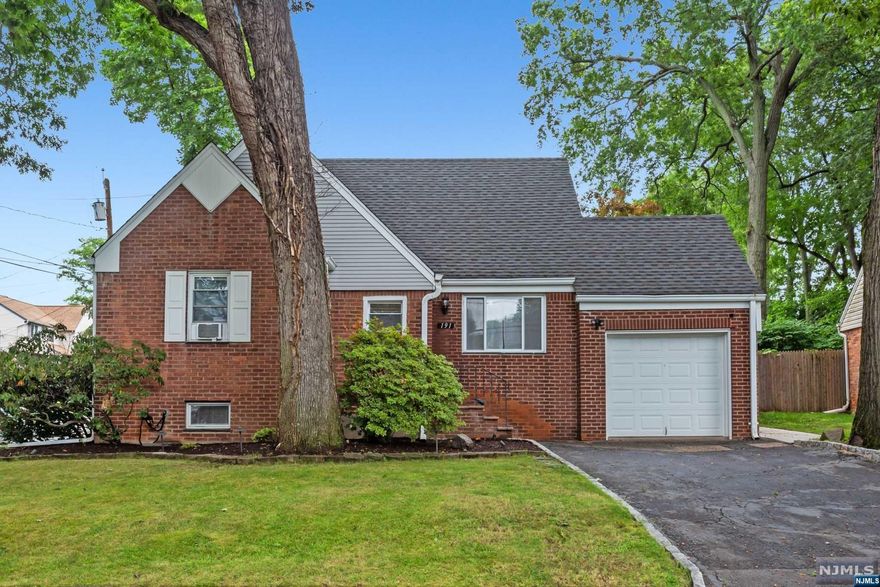 Welcome to this charming 3 bedroom, 2 bath Cape Cod home ideally located in the sought after town of Dumont. Great curb appeal invites you inside this sun-filled home featuring an entry foyer, large living room, dining room(which can be converted to potential 4th bedroom), updated kitchen, first floor bedroom & recently renovated full bath. Upstairs features 2 additional bedrooms, updated full bath and plenty of storage. A finished basement that offers endless possibilities and an attached 1-car garage. This corner property features a fully fenced in yard with a large patio and pergola perfect for outdoor entertaining and relaxation. Don't miss this opportunity to own a truly beautiful property that combines the perfect balance of serenity and convenience. Close to NYC transportation, houses of worship, shopping and schools. A wonderful place to call home!