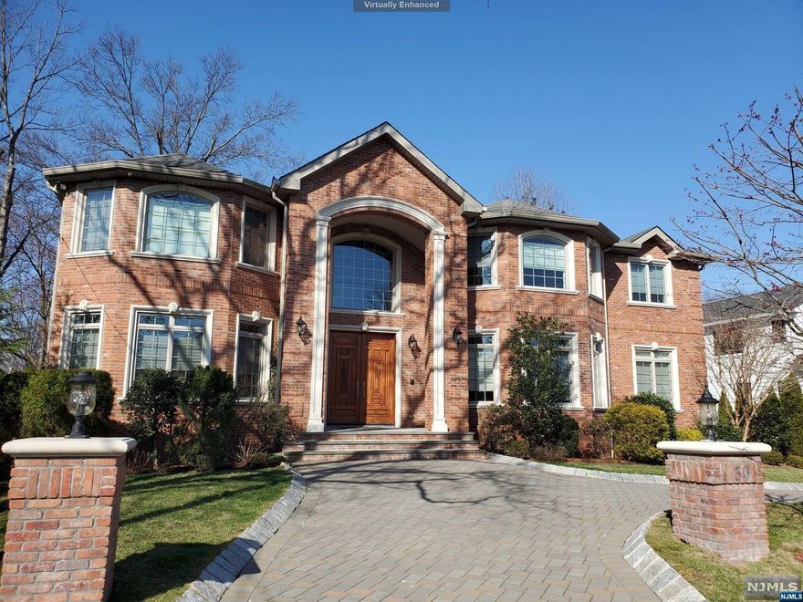 Elegant C/H brick custom built in 2012, boasting 9,000+/- sq ft of luxury living. Situated in the Premiere North side of Englewood Cliffs just miles to NYC. Soaring ceilings, extensive woodwork & radiant wood floors throughout. Comprised of 6 large bedrooms & 6.5 bathrooms including an En-suite bed/bath on the 1st floor. The gourmet eat-in kitchen is flooded with sunlight & open to the great room with double story ceilings. Professional appliances include Viking 6 Burner Range, 2 door Viking oven, Subzero refrig/freezer & large granite center island. Addl' features include a mahogany study & formal dining. The 2nd floor comprises 4 generous En-Suite bdrms/baths, laundry & master bedroom suite. The master features tray ceilings, fireplace w/marble, & balcony. Embellished in Honey Onyx the master bath has a Jacuzzi tub, steam shower & private water closet. A finished lower level includes a new bath/bedroom, mud room, wet bar, theater, wine cellar & rec room. Full house generator.