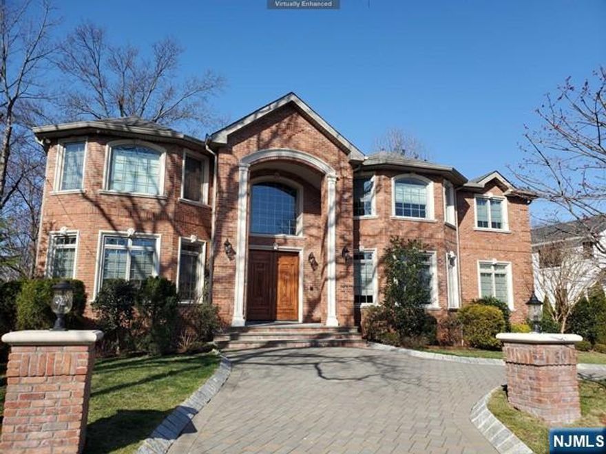 Elegant C/H brick custom built in 2012, boasting 9,000+/- sq ft of luxury living. Situated in the Premiere North side of Englewood Cliffs just miles to NYC. Soaring ceilings, extensive woodwork & radiant wood floors throughout. Comprised of 6 large bedrooms & 6.5 bathrooms including an En-suite bed/bath on the 1st floor. The gourmet eat-in kitchen is flooded with sunlight & open to the great room with double story ceilings. Professional appliances include Viking 6 Burner Range, 2 door Viking oven, Subzero refrig/freezer & large granite center island. Addl' features include a mahogany study & formal dining. The 2nd floor comprises 4 generous En-Suite bdrms/baths, laundry & master bedroom suite. The master features tray ceilings, fireplace w/marble, & balcony. Embellished in Honey Onyx the master bath has a Jacuzzi tub, steam shower & private water closet. A finished lower level includes a new bath/bedroom, mud room, wet bar, theater, wine cellar & rec room. Full house generator.