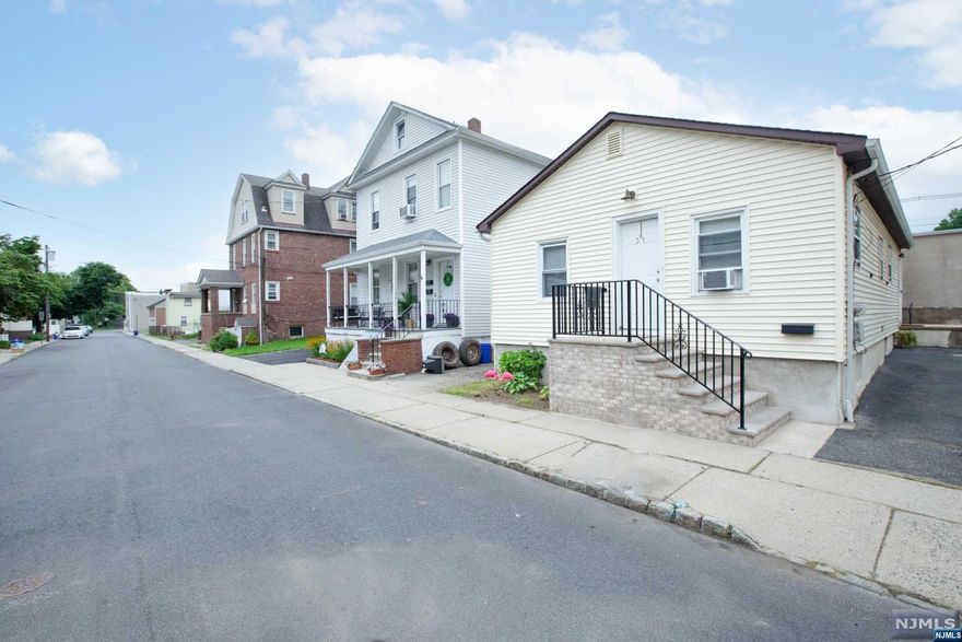 Welcome to the perfect 3-family investment home. A single-family AND a 2-family home on one lot with low taxes. The single-family home is rented for $2,200. The first floor of the two-family home is rented for $1,300. The second floor is vacant and in move-in-ready condition, with a potential rent of $2,000! This property is centrally located, with great school systems, and an overall fantastic investment opportunity. All utilities are separated and the driveway is rented with the single-family home. Be sure to reach out before it's gone!