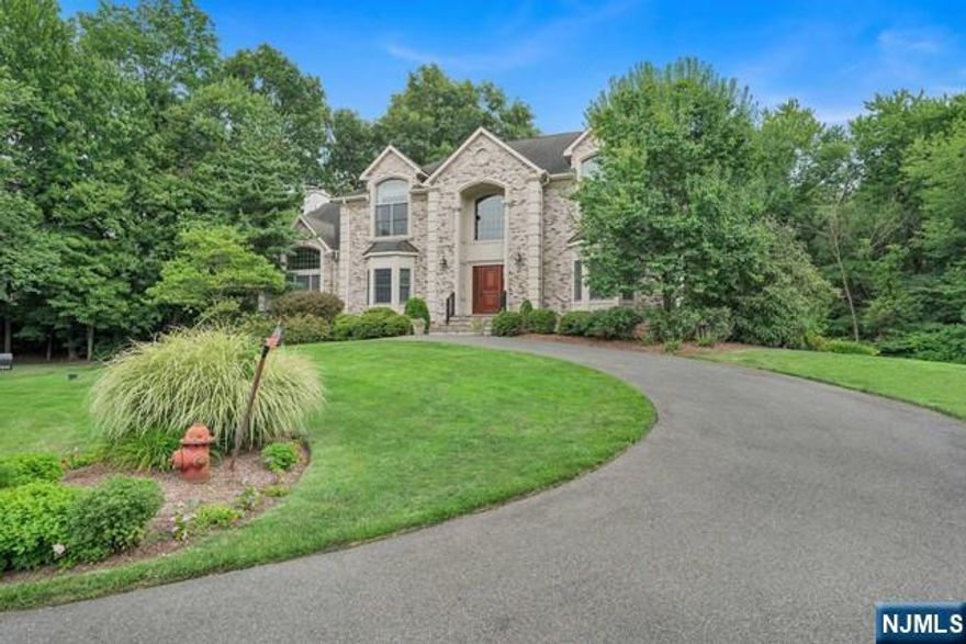 Stunning colonial nestled on cul-de-sac with 1 acre of property. This home features spacious foyer, large formal dining room, updated chefs kitchen, great room with fireplace, guest room with full bathroom, laundry and formal living room on first floor. The second floor includes 4 bedrooms and 3 full bathrooms including primary suite with luxury bathroom, walk in closet and sitting room with fireplace. Not to be missed is the added living space in basement which includes recreation area, and home gym. The backyard is unique setting on 1 acre of private lush property complete with covered deck, paver patio and built in BBQ. Home has a whole house generator, invisible fence and water softener. One of the best features of this location is it's proximity to NYC transportation, schools, and downtown shops and restaurants just steps away.