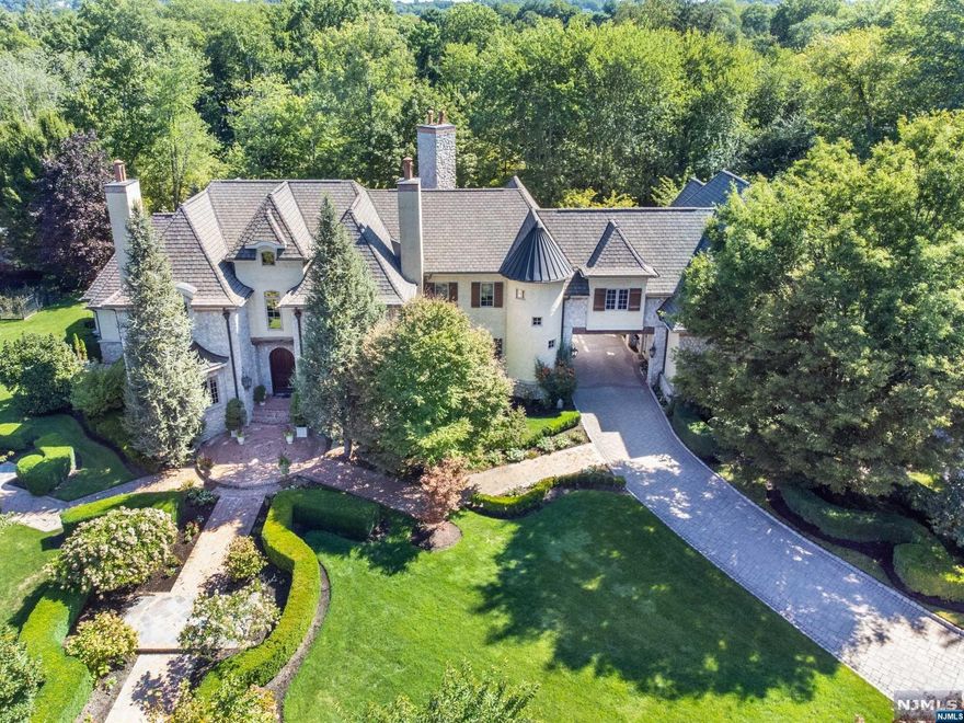 **NEW TAXES**THIS MAGNIFICENT FRENCH CHATEAU IS TRULY ONE OF A KIND CUSTOM BUILT & A BUILDER'S OWN HOME. THIS EXQUISITE HOME WAS BUILT IN 2004 OF THE FINEST CRAFTSMANSHIP & ARCHITECTURAL DETAIL WITH A FINISHED BASEMENT FOR ADDITIONAL LIVING SPACE. THIS PROPERTY SITS ON 1.75 ACRES OF GORGEOUS FRENCH GARDENS & SPECTACULAR POND VIEWS. BE PREPARED TO BE IMPRESSED WITH ALL THE STUNNING DESIGNER FEATURES THROUGHOUT SUCH AS, LUXURY PRIMARY BEDROOM SUITE ON THE 1ST FLOOR, 4 PLUS BEDROOMS, 8 BATHROOMS, ELEGANT DINING & LIVING ROOM, CUSTOM KITCHEN, LIBRARY/OFFICE WITH WALNUT CABINETRY FROM ITALY & BREATHTAKING GREAT ROOM. THE RESIDENCE ALSO BOASTS AN EXTRAORDINARY LIST OF AMENITIES INCLUDING 5 FIREPLACES, WINE CELLAR, MASSAGE ROOM, GYM, BUTLER'S PANTRY, FLOATING STAIRCASE, BARREL CEILING, BONUS ROOM, RADIANT HEAT, FINISHED BASEMENT, & 3 CAR HEATED GARAGE. MORNINGSIDE DRIVE IS ONE OF THE MOST DESIRABLE CUL DE SAC STREETS IN RAMSEY & A TRAIN RIDE AWAY FROM NYC. CLOSE TO DOWNTOWN RAMSEY.