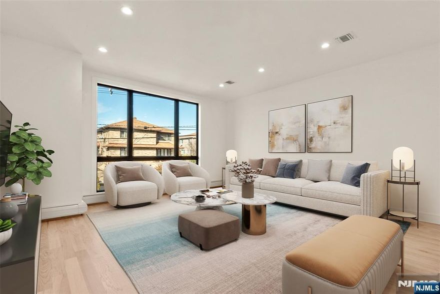 Experience modern sophistication in this pristine 3,100 square foot residence by the renowned PBS Builders, Inc. This Palisades Park new construction home offers a polished blend of high-end luxury and everyday functionality. Designed for the quality-conscious buyer, the home features a refined 3 bedroom, 3.5 bathroom layout anchored by sun-drenched open-concept living spaces, a formal dining room, and a gourmet eat-in kitchen. The kitchen is a centerpiece of the home, finished with premium materials, high-end appliances, and an expansive entertaining space that flows seamlessly into the main living area. Rich hardwood flooring spans both levels. The second floor hosts a private primary suite, two additional well-appointed bedrooms, and a full secondary bath. The versatile ground floor provides exceptional flexibility with its own private entrance, full bath, and summer kitchen. This is an ideal configuration for a guest suite, extended family living, or a professional home office. Perfectly situated just blocks from the vibrant Broad Avenue dining and shopping district, residents enjoy immediate access to premier restaurants, international markets, and local parks. With effortless NYC transportation and proximity to top-rated Bergen County schools, this residence is a rare turnkey find in a premier North Jersey location.