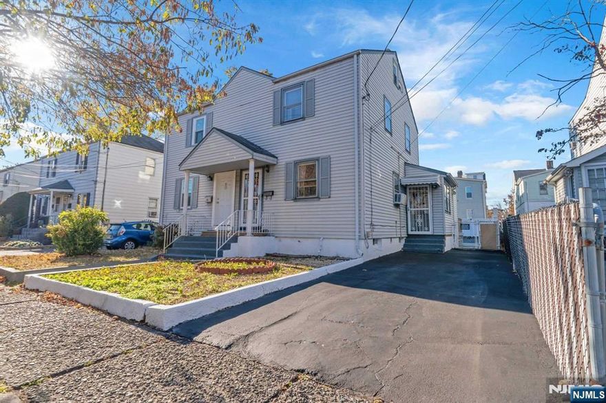 Welcome to 237 N 17th St, a beautifully updated 3-bedroom, 1.5-bath duplex in Bloomfield. This home combines modern convenience with classic charm. Inside, you'll find a spacious, sun-filled living room that flows into a gourmet kitchen with custom cabinetry, quartz countertops, and stainless steel appliances, including a double-door fridge and double oven gas stove. A powder room and pantry lead to the large, private backyard oasis, featuring a wooden deck, built-in pergola, tiki bar, and solar-powered lights perfect for outdoor entertaining. Upstairs are two generous bedrooms and a full bath, while the finished attic offers a versatile third bedroom or home office. The renovated basement adds a laundry area, rec room, and storage. Private driveway parking is included. Located in desirable Bloomfield, this home is ready to welcome you. Selling strictly as-is.