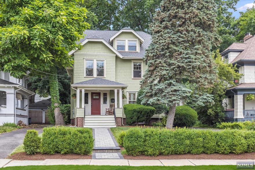 Be prepared to be infatuated with this picture-perfect, turn key Craftsman Colonial nestled between two NYC direct train stations, Edgemont Park, Walnut St Farmer's Market, and vibrant downtown Montclair. Leave the car in the garage as you go about your days on the lovely front porch or beautifully landscaped and private, canopied rear yard. Original architectural design, combined with thoughtful and sophisticated updates create a warm and welcoming aesthetic. The third floor primary suite, cozy screened-in porch, ductless AC system, mudroom, and first floor powder room round out this delightfully proud move-in ready property.