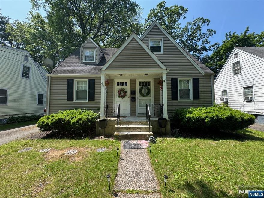 This inviting 3-bedroom, 1.5-bath first-floor apartment offers a spacious and practical layout. Step into a bright, oversized living room that seamlessly connects to a generous eat-in kitchenâ€”large enough for a table of six. The kitchen features ample counter space, abundant cabinetry, a gas range/oven, and a dishwasher. Two bedrooms with hardwood floors and good closet space share a full hallway bath with a shower over tub. The private primary suite, an addition at the rear of the home, includes a half bath and direct access to a deckâ€”ideal for grilling and outdoor dining. Enjoy shared backyard access and basement storage with washer/dryer hookups. Additional perks include central air conditioning (new system just installed), oil heat with steam radiators, and driveway parking. Conveniently located near schools, downtown shops, and restaurants.