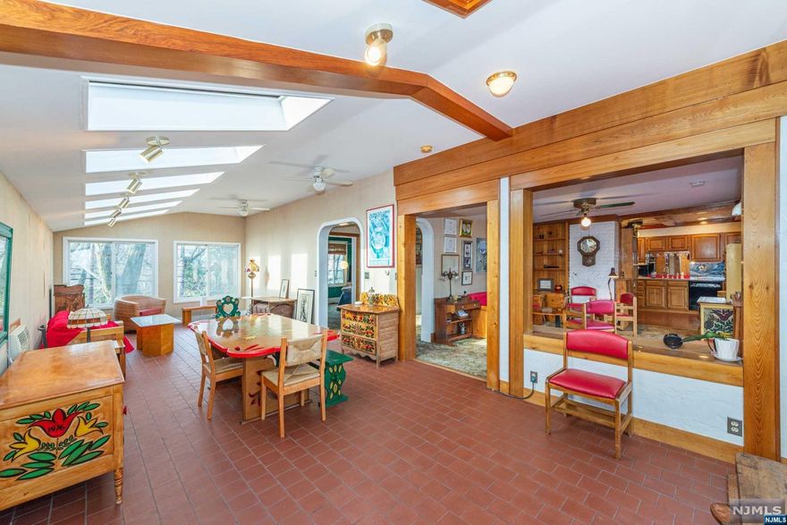 A truly delightful home with an artistic flair, this Upper Montclair two family is sure to please. Many special highlights include original molding, stained glass windows, high ceilings and balcony off the third floor bedroom. The oversized yard offers so many possibilities with a little over half an acre for a garden, pool, firepit, or whatever your heart desires. Currently used as a woodshop, the garage offers flexibility to suit various needs. The 1,670 sqft second floor apartment is ideal for an owner occupant or a great rental income producer offering two floors of spacious & bright rooms with large windows and skylights galore. The living room, family room, 1 bedroom, full bath, kitchen and dining room is located on the second floor with an additional two bedrooms, bathroom, ample closet space and laundry room on the third floor. Deck access from the living room and dining area is ideal for entertaining.