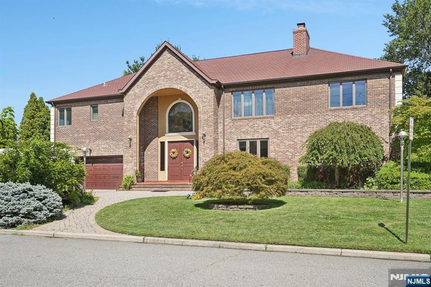 Welcome to this exceptional 5488 sqft residence, offering a perfect blend of elegance, comfort, and functionality, with generous living spaces across three levels. Ideal for both everyday living and entertaining, truly a property not to be missed! Step into the grand entry foyer with vaulted ceilings, setting the tone for the home's open and airy design. The gourmet kitchen features dual cooktops, stone countertops, a dishwasher, a large refrigerator, and a small breakfast nook. A formal dining room with large patio doors, which flows seamlessly to the patio and private backyard. The living room boasts cozy sitting area with a warm wood-burning fireplace. A spacious 1st floor bedroom suite includes a shared fireplace and a luxurious bath with whirlpool tub, while an additional small bedroom and full bath complete this level. Upstairs, enjoy a large family/office space, highlighted by a dramatic wall of picture windows. Bedrooms 3 and 4 share a convenient Jack & Jill bathroom with a private toilet and shower room. The primary suite is a true retreat with a spa-inspired bath featuring a whirlpool tub, separate shower, private toilet room, and double-sink vanity. A large walk-in closet and private balcony overlooking the backyard add to its luxury. The basement offering a family room with gas fireplace, pool table, bar, and a media room/library. Backyard Oasis step outside to your own private retreat with a large brick patio, gazebo, and a charming outdoor brick fireplace.