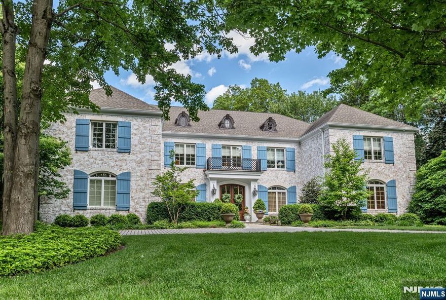 Exquisite 6-Bedroom French Manor-A Masterpiece of Design, Detail and Decor with Outdoor Oasis! Picture perfect with unparalleled warmth and beauty in an unbeatable location! Impeccable curb appeal and grand architecture set the stage! The majestic 2-story foyer with a sweeping bridal staircase opens into the formal Living Room and the formal Dining Room with 2 sets of elegant French doors. The sun-drenched chefâ€™s kitchen features a large center island, premium appliances and an expansive dining area with wall of glass that frames views of the outdoor space. The adjacent great room is beautifully appointed with coffered ceilings, intricate millwork, fireplace, rear staircase, and glass doors opening to the rear patio. Work in peace in the cherry library complete with rich craftsmanship, built-ins and trim detail. Upstairs 6 spacious bedrooms and 5 luxurious full baths offer private comfort plus enjoy the bonus built-in work/study space-perfect for young learners or remote working. The primary suite is your personal sanctuary with a resplendent walk-in closet and spa-like bath-an indulgent retreat! The fully finished lower level expands your living space with media room, play area, exercise studio & more! Step outside to a professionally designed private paradise featuring breathtaking pool with hot tub and cascading waterfall, an outdoor fireplace, and a large dining and lounge area! Too many incredible features to listâ€”this is a home that must be seen to be fully apprecia