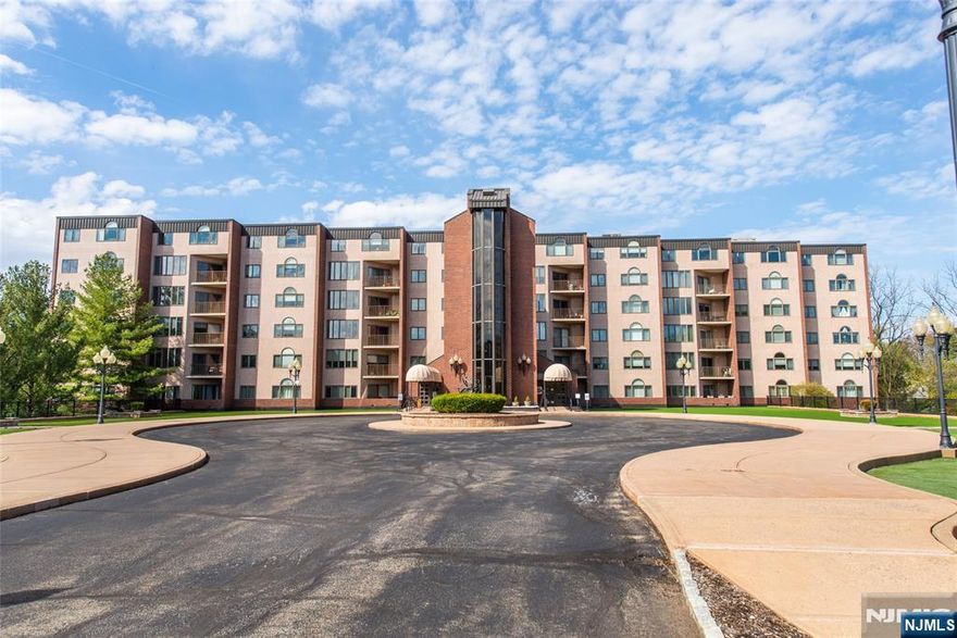 Stunning open floor plan with beautiful reservoir views all located in desirable Breckenridge community- Welcome Home! Luxury one-floor living at its best, featuring an impressive open floor plan concept with elegant and inviting foyer, beautiful formal dining room, living room with fireplace and multiple sitting areas, and a wall of windows overlooking the peaceful water views. Kitchen with custom features, stainless steel appliances and granite countertops. Primary Suite includes: two walk-in custom closets, a private bathroom with double sinks, a soaking tub, and a shower. Additional den/bedroom area: 2 rooms are perfect for an office or tv room. The second bedroom is also an ensuite with a full bathroom. Private balcony for your outdoor enjoyment overlooking the reservoir. Additional attributes include: a wonderful home for entertaining, custom window shades, a powder room, tons of natural light, hardwood floorsthroughout, tons of closets, and laundry room. Very well maintained and ready to move in. Incredible lifestyle includes doorman, recreational room, pool, gym, tennis courts, pickleball, enclosed parking and storage room. Impressive desirable location: Top rated schools, Minutes to shopping, Trader Joe's, Whole Foods, restaurants, major highways, and NJ Transit Bus and Train center. Everything you have been waiting for with turnkey living!