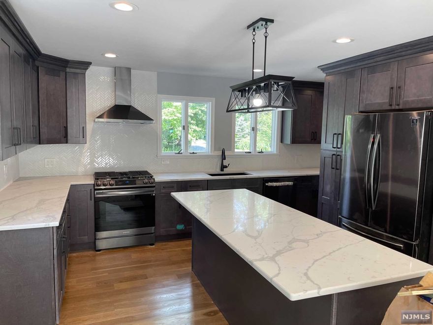 Lakefront Living Meets Modern Luxury! Welcome to this Fully Renovated Oasis! Kitchen Includes Custom Slow-Close Cabinets, Quartz Counters, Moen Fixtures, Black Stainless Steel Samsung Appliances. Grand Bedroom w Cathedral Ceilings, Double Closet and Lake View. Both Bathrooms include Custom Vanities, Black Moen Fixtures. New LED Lighting Throughout. New Hardwood On Main Level and New Carpeting In BRs. New Roof, High Efficiency Furnace, Well Pressure Tank, Hot Water Heater, & Water Softener. Deck Overlooking Water Ideal for Entertaining! Beautiful Wooded & Landscaped Property Leading Right To Deck & Dock On The Lake! Plenty Of Parking! Close To UGL Clubhouse & Beach! Come Enjoy All That Upper Greenwood Lake Has To Offer: Motor Boating, Power Boating, Jet & Water Skiing, Canoeing, Kayaking, Swimming, Fishing, & More! Perfect For A Weekend Getaway Or Year-Round Enjoyment! Don't Miss This Amazing Lakefront Home! Located 1 Hour From NYC, and close to Warwick's Wineries and Restaurants!