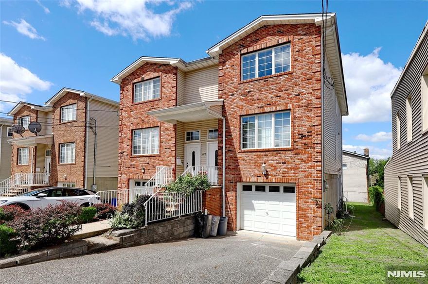 3-bedroom, 3.5-bathroom right half of a duplex in Garfield, Bergen County, is a must-see. The property features a practical layout with fully renovated bathrooms and a modern eat in kitchen. All renovations have been completed with attention to detail, including new appliances that enhance the functionality and appeal of the home. Home has newly refinished hardwood flooring, a side yard, backyard and a deck. This is a self managed duplex/townhouse. Come visit this beautiful home.