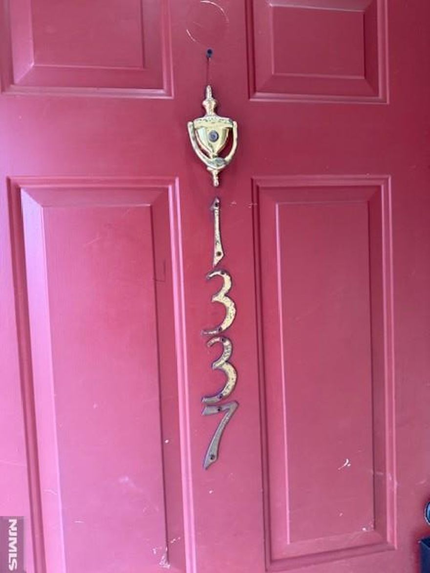 Welcome to this show-stopping Paddington Square unit. Recently reimagined with chic, contemporary finishes, this home features a stunning open-concept main level highlighted by a custom glass railing and sleek new vinyl flooring. The heart of the home is the updated kitchen (2022), complemented by a stylishly renovated first-floor bath. The main level also has two bedrooms, both featuring fresh paint and cozy carpeting. Relax by the fireplace, now featuring modern black stone tile for a warm yet sophisticated feel. Upstairs, the primary suite offers a private full bath and walk-in closet, while the expansive loft provides the perfect footprint for a home office or gym.. community Pool.