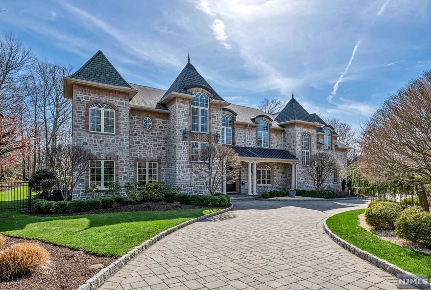YOUR DREAM HOME AWAITS IN THIS ALL STONE MANOR WITH CIRC STONE DRIVEWAY & REAR YARD OASIS. ENTER THIS GRAND 2 STORY EF THAT OPENS TO FABULOUS GREAT RM W/FP, COFFERED CEILING. CUSTOM LR W/WET BAR, BANQUET SIZE DR W/BUTLR'S PNTRY & WINE FRIDGE. OVERSIZED BRIGHT HIGH END KITCH W/BREAKFAST RM & WORK STATION. CUSTOM OFFICE W/BLT INS, FULL BATH, PR, MUD ROOM, LAUNDRY RM & ENTRY TO 3 CAR GARAGE COMPLETE THE 1ST FL. THE 2ND FL BOASTS A WIDE MEZZANINE, PRIV PRIMARY SUITE W/STTG RM W/FP, LUX SPA LIKE BATH W/SS, 2 WIC'S & OFFC SPACE. 4 ADDT'S LARGE BR'S ENSUITE W/CSTM CLOSETS, WALK UP ATTIC. FINISHED LWR LEVEL IS A DREAM W/WET BAR, GAMING AREA, FAM RM, GYM, WINE ROOM FULL BATH AND AMPLE STORAGE. REAR STONE PATIO W/FP PERFECT FOR ENTERTAINING ALL YEAR ROUND. POOL, FULLY FENCED YARD, GENERATOR. GRT LOCATION, TOP RATED SCHOOLS. THIS IS A BREATHTAKING ESTATE !