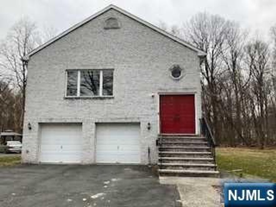 Young Brick faced Bi-level on tree lined street. Features include large living room, formal dining room, modern eat-in-kitchen, master bedroom suite with full bathroom and 3 spacious closets. Sliding glass door to balcony, two more bedrooms, and full bathroom. Ground floor features family room and full bathroom. 2 zone a/c and heating, over sized 2 car attached garage. Near schools, public transportation, houses of worship and shopping, easy access to route 4 and minutes away to Manhattan via GW bridge.