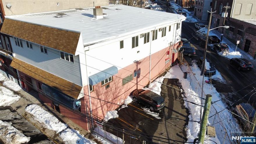 Great space suitable for light industrial, small warehouse/wholesale, approx. 2000 sq ft with restroom and office in the rear, formerly used as an auto upholstery shop, (NO FOOD, NO CAR REPAIR Facility, NO Combustible of any kind), approx. 12ft overhead door and side door entrance as well, great location with good visibility on a main road, close to downtown Paterson and major highways in close proximity.