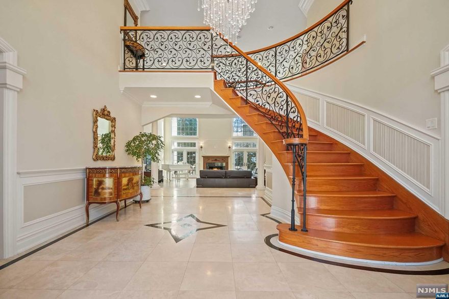 Refined Custom-Built Brick Central Hall Colonial in Prestigious North Cliffs. Meticulously designed residence opens to grand two-story foyer w/elegant floating staircase. Main level features bright living room,library/guest suite, and formal dining room. Spacious two-story great room features a granite fireplace & French doors to a paver patio. Gourmet eat-in kitchen boasts custom cabinets, generous island, top-of-the-line appliances, and Butler's pantry. Primary suite with gas fireplace, tray ceilings, bath with a Jacuzzi and steam shower. All bedrooms en suite. Basement provides ample entertainment space with a wet bar, bedroom, full bath, wine cellar.