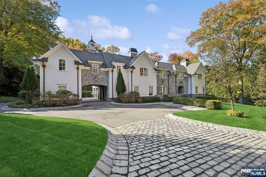 BEST LOCATION IN DEMAREST! SENSATIONAL, CHARISMATIC, FLAWLESSLY EXECUTED STONE & HARDY PLANK TRANSITIONAL COLONIAL WITH PORTE-COCHERE. 8 BEDROOM SUITES! FRONT TO REAR FOYER WITH HARDWOOD FLOORS OPENING TO AN ALL-SEASON STONE FAMILY ROOM WITH FIREPLACE AND AUTOMATIC SCREENS FOR EASY INDOOR AND OUTDOOR LIVING. LARGE LIVING ROOM WITH WETBAR, LIBRARY, AND DINING ROOM WITH STONE PORCH. COUNTRY KITCHEN WITH BREAKFAST AREA FEATURING SOUTHERN EXPOSURE, NEW BEDROOM W/FULL BATH, 2 POWDER ROOMS AND 3 CAR GARAGE ON THE MAIN LEVEL. FRONT AND REAR STAIRCASE.THE PRIMARY SUITE ON THE SECOND FLOOR FEATURES TWO WARDROBE CLOSETS, INCREDIBLE PRIMARY BATH, AND HUGE TERRACE OVERLOOKING THE REAR YARD AND POOL. 5 ADDITIONAL BEDROOM SUITES WITH BATHS. THE LOWER LEVEL IS FULL, FINISHED, WITH HIGH CEILINGS AND INCLUDES A HUGE PLAYROOOM, THEATER, GYM, WINE CLOSET, AND BEDROOM WITH FULL BATH. FULL HOUSE GENERATOR! WELL LANDSCAPED, AND PRIVATE! SHOWS LIKE NEW! RECENTLY RENOVATED AND UPGRADED!