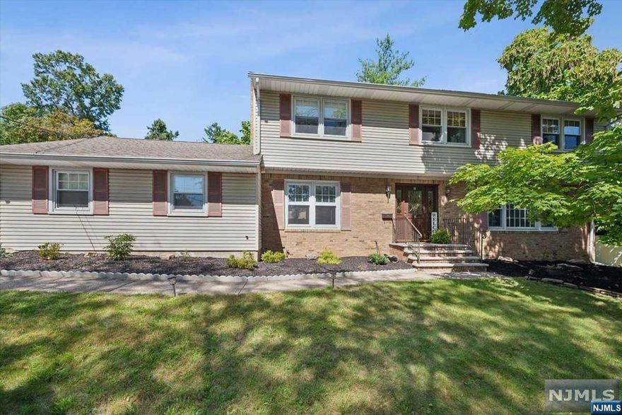 Bright & spacious 5 bed/3.5 bath/2-car garage Center Hall Colonial w/fully finished basement & serene backyard on quiet cul-de-sac in the heart of Wayne. Enter Foyer to find a formal livingroom to the right through French doors & a classic familyroom to the left with brick fireplace & sliders to backyard. Large eat-in kitchen w/ample storage, counter space, double ovens, custom tile work & bay window. Formal diningroom sits between kitchen & livingroom. Finished oversized 2-car garage w/attic storage, powder room & laundry room w/storage, extra fridge & backyard access. Upstairs has 3 sizable bedrooms w/hall bath & primary suite w/walk-in closet & full bath. Hardwood floors throughout 1st & 2nd levels (under carpet). Basement offers more living space with 5th bedroom, 2nd familyroom, full bath, storage/utility room & pantry. Backyard w/fire pit, stone patio & raised lawn. Enjoy direct access to routes 80, 23 & 46, top-rated schools & NYC trains(Montclair Boonton Line).