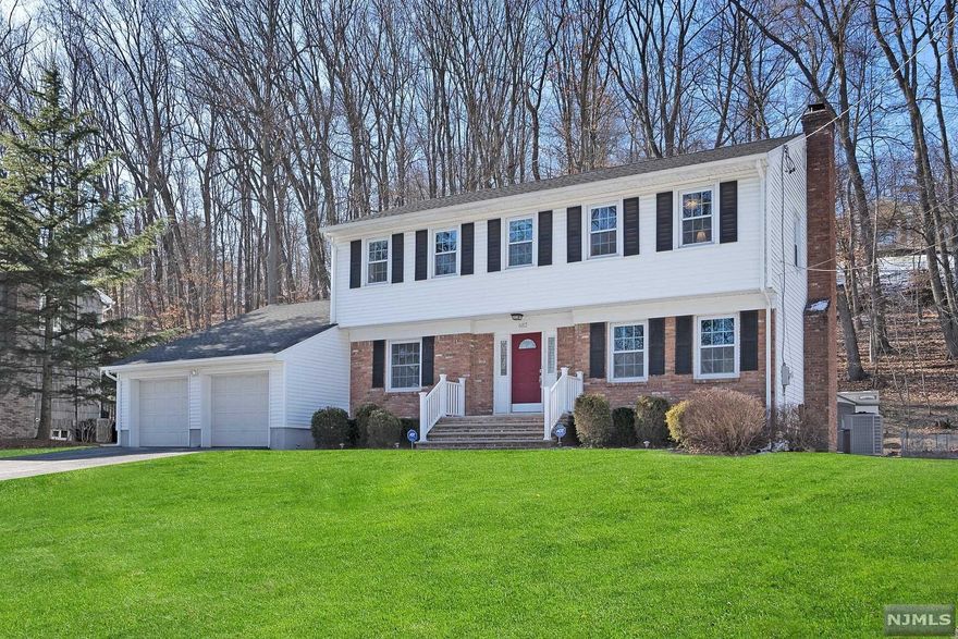 WELL MAINTAINED CENTER HALL COLONIAL ON DESIRABLE CUL DE SAC FEATURES A LARGE LIVING ROOM WITH WOOD BURNING FIRE PLACE, FORMAL DINING ROOM, BRAND NEW EAT IN KITCHEN WITH WHITE CABINETS,STAINLESS STEEL APPLIANCES, QUARTZ COUNTERTOPS,UNDER CABINET LIGHTING,TILED BACKSPLASH, SPACIOUS PANTRY,HALF BATH AND FAMILY ROOM WITH SLIDERS TO DECK AND PRIVATE,OVERSIZED PROPERTY. UPSTAIRS INCLUDES A LARGE MASTER SUITE WITH DOUBLE CLOSETS, MASTER BATH, THREE ADDITIONAL OVERSIZED BEDROOMS AND RENOVATED FULL BATH WITH JACUZZI TUB. LOWER LEVEL INCLUDES LARGE BASEMENT WITH LAUNDRY AREA. ADDITIONAL FEATURES INCLUDE UPDATED 200 AMP ELECTRIC, HARDWOOD FLOORING THROUGH OUT, CROWN MOLDINGS, NEWER WINDOWS, NEWER ROOF, NEWER CENTRAL AIR, PLENTY OF STORAGE AND LARGE TWO CAR GARAGE.