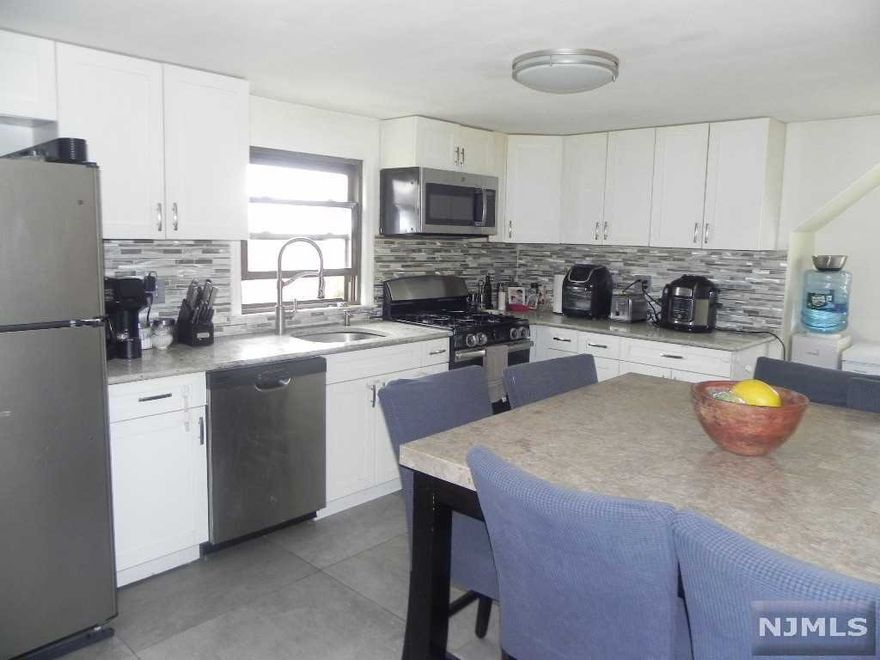 THIS SPACIOUS 2 FAMILY HOME FEATURES ON THE 1ST FLOOR, A LIVING ROOM/DINING AREA, UPDATED EAT IN KITCHEN, 3 NICE SIZE BEDROOMS AND A FULL BATH. THE GROUND FLOOR WHICH IS PART OF THE FIRST FLOOR FEATURES A FAMILY/DEN/OFFICE/PLAY ROOM, UPDATED EAT IN KITCHEN AREA AND A FULL BATH. ALSO ACCESS TO THE GARAGE. THERE'S ALSO A DOOR TO THE BACKYARD. THE 2ND FLOOR FEATURES A LIVING ROOM, LARGE UPDATED EAT IN KITCHEN, 2 BEDROOMS AND A FULL BATH. BOTH THE FIRST AND SECOND FLOORS HAVE HARDWOOD FLOORS. BEING SOLD AS IS. CALL TODAY FOR AN APPOINTMENT.