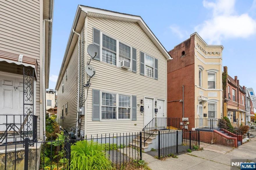 Discover an exceptional two-family investment opportunity in Greenville's most dynamic corridor, where accessibility meets opportunity. This income-generating property presents remarkable versatility for the savvy investor seeking reliable rental returns or the astute buyer envisioning their primary residence with rental income potential. Positioned minutes from the Richard Street Light Rail Station, commuters will appreciate seamless connectivity to downtown Jersey City, Hoboken, and Manhattan, while major highway access ensures effortless travel in any direction. The location captures the pulse of Greenville's exciting transformation, as this emerging neighborhood experiences unprecedented revitalization with new businesses, enhanced streetscapes, and community investments that mirror the successful renaissance of neighboring Bergen-Lafayette. Whether you're an investor building your portfolio with steady cash flow or a homeowner seeking to offset your mortgage through rental income, this property delivers flexibility and potential. The evolving landscape surrounding this home signals a neighborhood on the rise, making now the ideal time to establish your stake in one of Jersey City's most promising areas. Don't miss this chance to capitalize on location, transit access, and the momentum of positive change transforming this vibrant community.