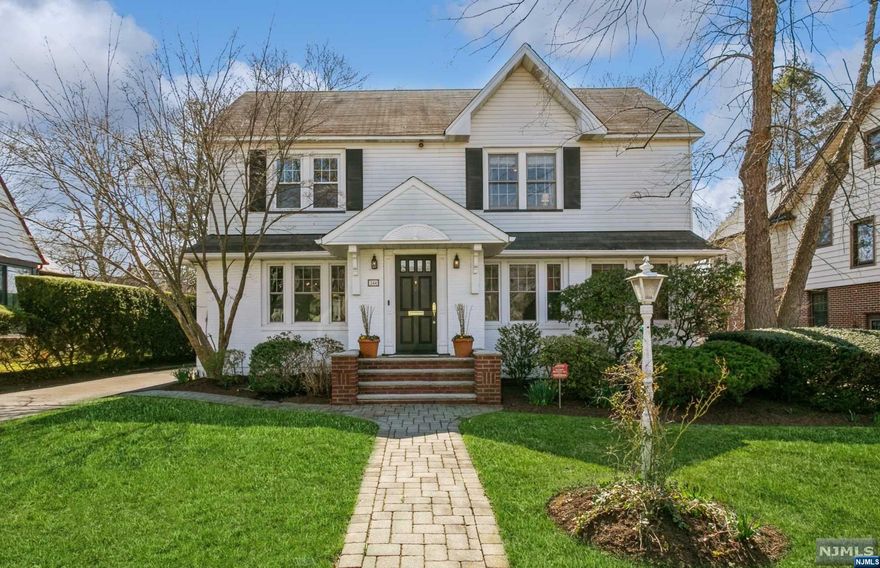 Wonderful Colonial w/nearly 3000 sq ft of living space on oversized lot (60x135)! Charming 1st floor features entry, large Living Room w/FPL, Den/Home Office, Formal DR, PR & Huge Family Room w/FPL open to spacious Eat-in Kitchen w/granite counters, maple cabinetry, stainless steel appliances, breakfast table area, etc. 2nd Floor offers 4 BRs including roomy Primary Bedroom w/MBTH, additional Full Bath in hallway & stairs to unfinished attic with lots of space for storage. Large Basement has finished RecRoom, Storage Rm, Workshop/Utilities Rm, FBTH (SS) & Laundry Room. French Drain system; 2-Zone Gas Heat (two furnaces) plus BB electric heat in basement; 2-zone Central A/C; Hardwood floors; Central Alarm system; Brick & vinyl siding exterior, Newer Windows, Newer Roof (8 yrs); NOTE: 1yr AHS Home Warranty included; Large deck off family Rm overlooking lush landscaped property with U/G sprinkler system. Terrific location on quiet block close to houses of worship & NYC transport.