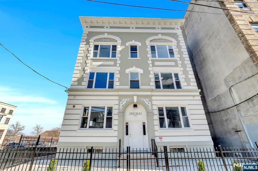 Modern living meets city charm in this stylishly rebuilt 1-bedroom apartment at 155"157 Clifton Avenue, Newark, located directly across from the iconic Cathedral Basilica of the Sacred Heart. This beautiful unit features an open-concept living, kitchen and dining area, complete with stainless steel appliances, including a refrigerator, ceiling-mounted ductless heating and cooling systems, and in-unit laundry hookups all thoughtfully designed for comfortable, low-maintenance living. Set within a recently updated building, residents also enjoy shared access to a yard, a rare perk in city living. Take a relaxing stroll through nearby Branch Brook Park or explore everything Newark has to offer just minutes from downtown dining, shopping, concerts, and the Prudential Center. Convenient public transportation nearby makes commuting effortless. Tenant pays gas and electric only. No pets permitted. Some photos may be virtually staged.