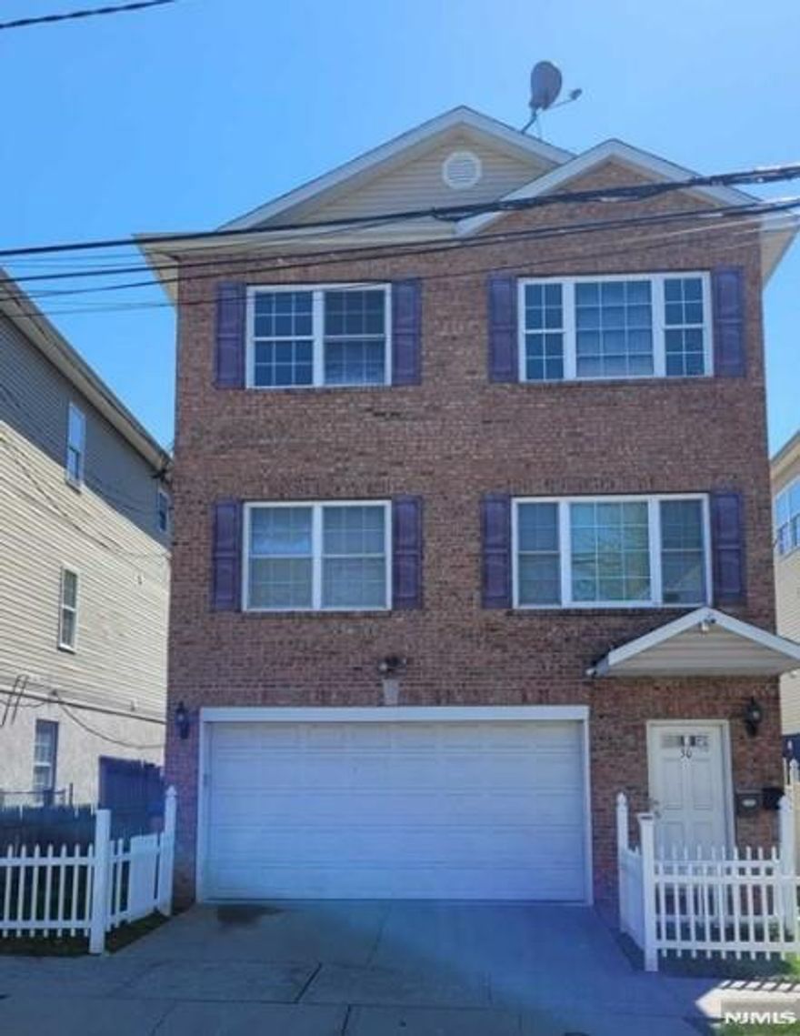 Welcome to this beautiful two-family home, complete with bonus spaces offering extra living options. Each unit features a spacious layout with three generously sized bedrooms and two full bathrooms. The primary bedrooms include their own private bathrooms for added comfort, along with central air and central heat. The property features wood flooring throughout, a two-car garage, and a beautifully finished basement with an additional bathroom, Move-in ready, Sold as-is