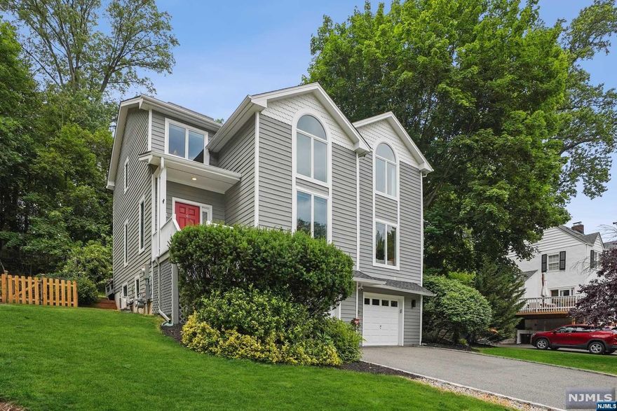 Welcome to this beautifully built & maintained contemporary colonial w/sunken LR, Fam Rm w/FP & gourmet kitchen leading to private deck & backyard. Laundry Rm on 1st FL. Amazing primary suite w/walk-in custom closet & spacious, new spa-like bath. 2nd BR w/custom closet, BR w/podcast/recording booth & full updated bath on 2nd floor. Lower level w/BR & walkout. Garage equipped w/Tesla PowerWall backup generator. Smart home system. Located on cul-de-sac close to UM Village & trans. to NYC. Recent enhancements include new appliances, new wood floors on 2nd floor, new roof, AC condensers & handlers, & a new solar system. Complete architectural plans for new bathroom on lower level. ***Taxes subject to change due to current taxes reflecting owners' VA status.*** Such an opportunity!