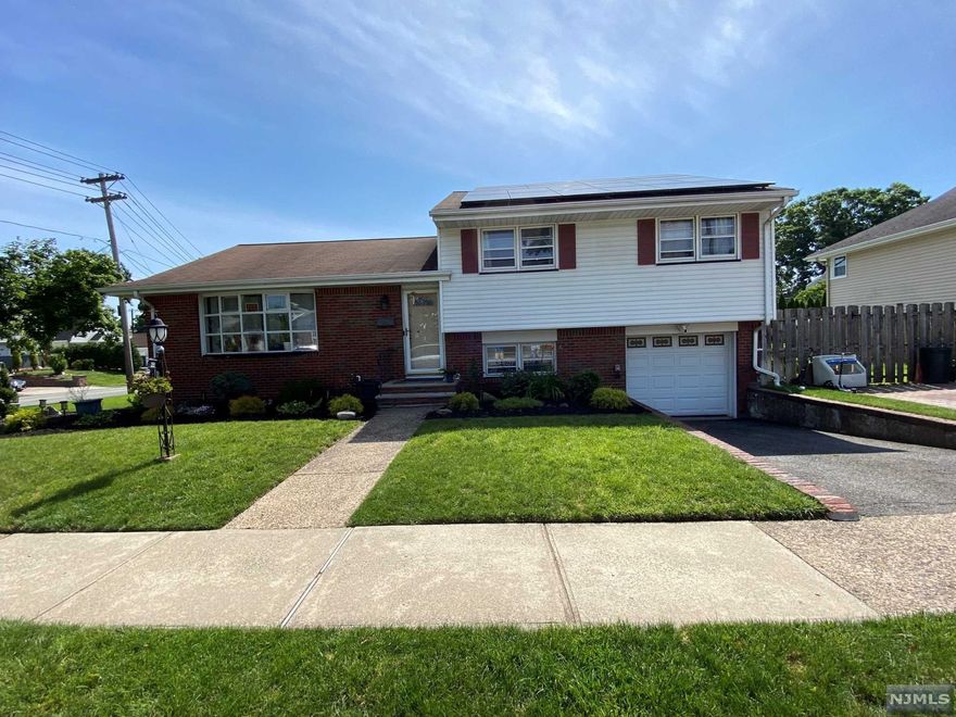 Sunny Split level home in the Graphics Blvd section of Bergenfield close to NYC and a short walk to beautiful Coopers pond . Walking distance to the public school system and house of worship. Entryway leading to a modern eat in Kitchen with a granite island .Kitchen leads into a Formal Dining Room and an updated living room . Ground Level has a nice den/ family room with a half bath and an attached Garage. Upstairs has a Master bedroom with master full bath plus two additional bedrooms and another fully updated full bathroom .Finished open basement that can be used as a home office /Rec room plus a laundry room /Utility room. Outside has a nice yard with a inground sprinkler system and new landscaping . New HVAC was installed in 2021.Newer 50 gallon plus water heater was installed in 2019.Updated 200 amp Electric Panel . Owner will transfer their New Milford Town pool membership to buyers.