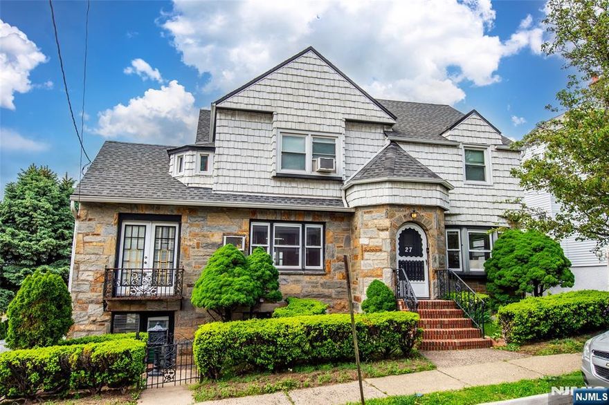 This two-family home radiates classic elegance. Set behind a beautiful stone facade with an arched doorway, the property offers a unique layout and vintage character throughout. The first unit features a bright living room with a wood-burning fireplace and a bay window that fills the space with natural light. The eat-in kitchen is generously sized, providing plenty of room for both cooking and casual dining. Two bedrooms are included â€“ one of which connects to a large bonus room, flexible as a home office, den, or oversized bedroom. A full bathroom and private access to the basement complete the space. Upstairs, the second unit includes its own eat-in kitchen, a spacious living room, two more bedrooms, a full bath, and its own laundry area â€“ ideal for extended living or rental income. The basement offers an additional bathroom and ample storage â€“ great for expansion or organization. Out back, the deep, sloping yard is a standout feature with two small ponds, a red footbridge, mature landscaping, patio space, a two-car garage, and a driveway that fits up to five cars. Located just minutes from local shops and restaurants, schools, and Plauderville Station (NYC access). Both units will be delivered vacant, offering flexibility whether youâ€™re looking to live in, rent out, or both. A rare opportunity with charm, space, and potential â€“ donâ€™t miss it.
