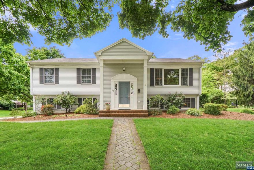 Prepare to fall in love with this pristine Bi-Level home nestled in Midland Park, where nice surprises await at every turn. Outstanding curb appeal welcomes you inside to an oversized entry foyer, leading up a few steps where you'll be captivated by beautiful hardwood floors, freshly painted rooms, and quality architectural details. The formal LR seamlessly flows into the DR and gourmet EIK, complete with top-of-the-line appliances. Discover the primary bedroom with a walk-in closet and full bath, along with two additional BRs boasting double closets & ceiling fans, complemented by a newly remodeled full bath. Downstairs, there's a cozy FR, a fourth BR with two closets, a convenient powder room, laundry room with rear-yard access, and entry into the two-car garage. Additional amenities include a composite deck overlooking the fenced-in yard, central air, irrigation system, and more. Completely turnkey and move-in ready; don't miss the chance to make this your home today!