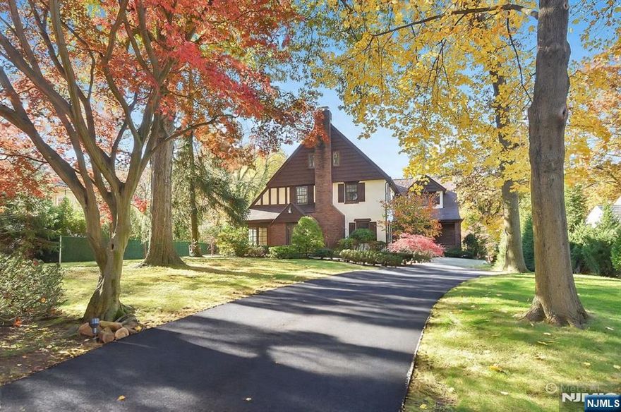 Located on the prestigious East Hill of Tenafly, this move-in-ready home offers a bright, spacious interior with numerous updates, including a renovated eat-in kitchen and a full-house generator. The first floor features a large family room with a wood-burning fireplace, a formal dining room with French doors opening to a sun-filled den with custom built-ins, and an expansive kitchen with white cabinetry, granite countertops, stainless steel appliances, a two-tiered center island, and a breakfast area surrounded by windows with access to the deck. The second floor includes a newly designed primary suite with a large walk-in closet, three additional bedrooms with custom-fitted closets (one with an ensuite), and updated finishes throughout. The third floor provides a flexible space ideal for an office, den, or fifth bedroom. A finished basement, beautifully landscaped backyard perfect for entertaining, and a spacious three-car garage complete this exceptional home. Most recent updates: New hardwood floors on the second floor and new driveway. DETACHED GARAGE & FIREPLACE AS IS