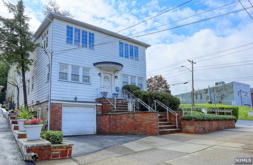 Rare to find 2 family in a business zone.That has been use as a mixed use office/Residential. With 3 units of central air; 4 zones of central and heating ; including also power generator. Property offers first part; family room, office/living, bedroom, walk in closet, full bathroom, eat in kitchen, spacious dinning. 2nd level offers 4 bedrooms, living room. full bathroom. Master bedroom w Cedar Closet. Finished attic w/two rooms.Full Finished basement with full bathroom, kitchen, bar area, living leading to the attached garage and Drive way. Walking to transportation, schools , shopping , bus stop snd train to NYC and all major highways.