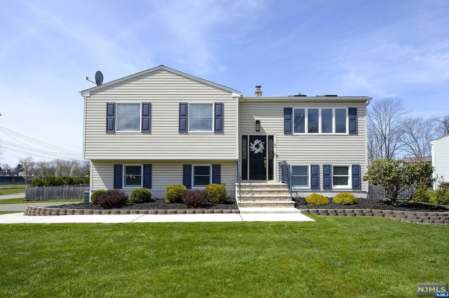 Welcome to this pristine three bedroom, two bathroom bi-level. The main floor showcases a spacious living room, with high ceilings and flooded with natural light. The updated kitchen flows into the dining room for easy entertaining. Sliding glass doors lead to the trex deck that overlooks the expansive, fenced in back yard with a picturesque fire pit and beautiful landscaping. The over-sized primary bedroom has three closets for ample storage. A second bedroom and full bathroom complete the main level. On the ground floor, a two car garage, bedroom, gorgeous newly renovated full bath and a family room with sliding glass doors that lead to the covered back patio. Updates include new appliances, new laundry area, new vinyl flooring on the ground floor, new front walkway. The downstairs bathroom was recently upgraded from a half bath to full bath and the whole house was converted from oil to gas!