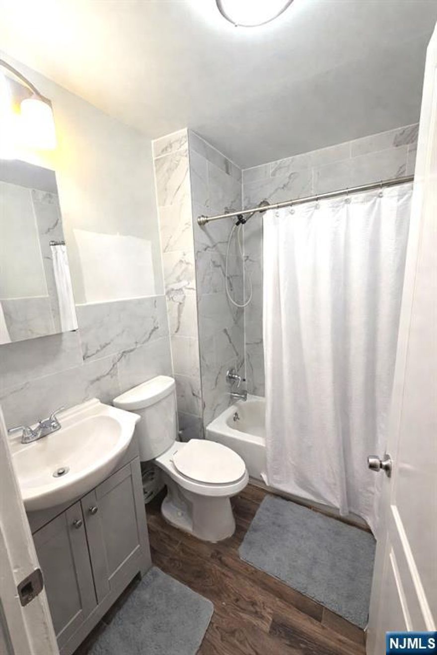 438 Devon Street, Unit #2, Kearny is a beautifully renovated 4-bedroom, 2-bath duplex apartment offering modern finishes, a spacious living area, and a separate spacious dining room perfect for entertaining. This bright and move-in-ready unit features an updated kitchen and bathrooms, generous bedroom sizes, and 1 off-street parking space included. Located in a prime Kearny neighborhood with easy access to public transportation, major highways, and a quick commute to NYC, making it ideal for commuters. Close to shopping, dining, parks, and schools. A rare opportunity to rent a large, renovated duplex in an unbeatable location.