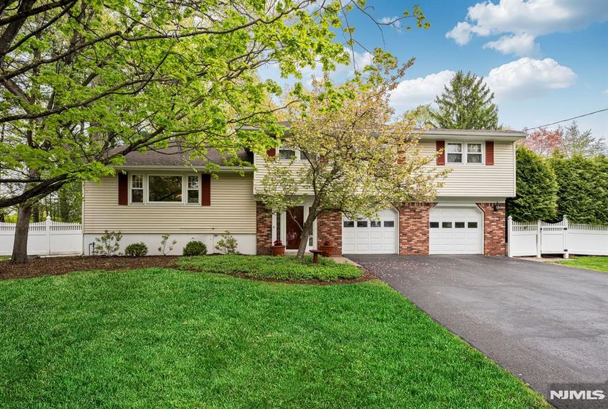 Tucked away on a quiet cul-de-sac in desirable Wyckoff, this beautifully maintained split-level home offers 3,096 square feet of thoughtfully designed living space. Hardwood floors run throughout, complemented by elegant crown mouldings that add timeless character. A formal dining room with French doors opens seamlessly to the sun-filled great room addition, creating an ideal flow for entertaining and everyday living. The great room is warm and inviting, enhanced by one of two gas fireplaces for added comfort and ambiance. The finished basement offers additional living and storage space, including cedar closets that provide ample room for organization. An oversized attached two-car garage adds everyday convenience. Step outside to your own private backyard retreat featuring a poolâ€”ideal for relaxing or hosting summer gatherings. Located just a block from the NYC bus and close to award-winning Blue Ribbon schools, this home combines a peaceful neighborhood setting with exceptional lifestyle amenities.