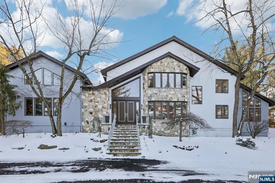 This is THE ONE that has it ALL! LOCATION MATTERS: 1/2 Acre on one of RIKER HILL's Most Prestigious Streets. SIZE MATTERS: This 6 Bedroom,5 Full bath + One half bath home boasts approx. 6500 sq ft of Living Space incl Finished Basement plus 3-car Garage. STYLE MATTERS: Forever-in-Demand Custom CONTEMPORARY known for its GREAT ROOM with 25 ft CATHEDRAL Ceiling, Gas FP and Tons of NATURAL LIGHT. Home Features an Impressive600 sq ft Chef's BRIGHT KITCHEN with10 Ft Long Quartzite TWIN Islands, Gourmet Wolf/Subzero SS Appliances (incl. 3 ovens and 2 Dishwashers) Open to LARGE Family Room with 2nd Gas Fireplace and Multiple Sliders flowing out to Expansive TREX Deck and STONE Patio. Main Floor Bedroom/Office and Full Bath perfect for MULTI-GENERATIONAL Living. HUGE 1200+ Sq Ft MASTER EN-SUITE with NEW SPA-LIKE Bath, Double-Sided Fireplace, 2 WIC, 2nd Laundry and Sitting Room/Office. Separate "wing" includes 3 Bedrooms and 2 RENOVATED Baths. FINISHED BASEMENT incl Rec Room, Bedroom #6, FULL Bath, Exercise Room, Laundry #2 and TONS of Storage. Additional Highlights: Main Floor Brazilian Walnut floors, 5 SLIDERS out to DECK/PATIO, Whole House GENERATOR, Built-in Speaker system, Tesla Wall Charger, new driveway and much more!! This is a VERY SPECIAL Property with spectacular SUNSET VIEWS backing up to COUNTY PARKLAND!