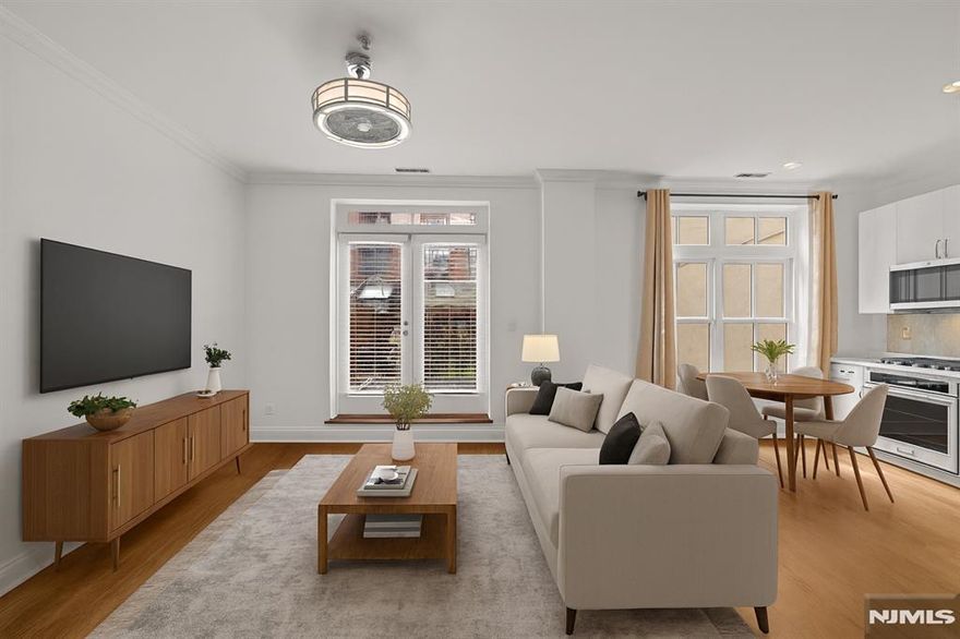 Welcome to 104 York Street, an exceptional boutique residence situated in the highly sought-after Paulus Hook neighborhood of Jersey City. This rare offering features two bedrooms, two bathrooms, and a beautifully designed private backyard with a patio. The open-concept living and dining area flows seamlessly to a spacious deck that leads to a serene backyard oasis with pavers, professional landscaping, elegant lighting, and full fencing, perfect for relaxing or entertaining. The top floor showcases a renovated chefâ€™s kitchen equipped with new KitchenAid appliances, complemented by gleaming hardwood floors that extend throughout the home. The lower level includes two generously sized bedrooms, one with direct access to the tranquil yard, while the primary suite features a fully renovated bathroom with a sleek vanity, modern fixtures, and updated lighting. Additional highlights include freshly painted interiors, crown molding, a gut-renovated guest bathroom, and the convenience of an in-unit washer and dryer. Ideally located within the desirable PS16 school district and near top private schools, this home offers unparalleled access to transportation, including Exchange Place PATH, Grove Street PATH, and the Manhattan ferry. Enjoy proximity to Jersey Cityâ€™s finest restaurants, Whole Foods, parks, boutique shops, and vibrant nightlife. Combining luxury, comfort, and an unbeatable location, this property is truly move-in ready and not to be missed.