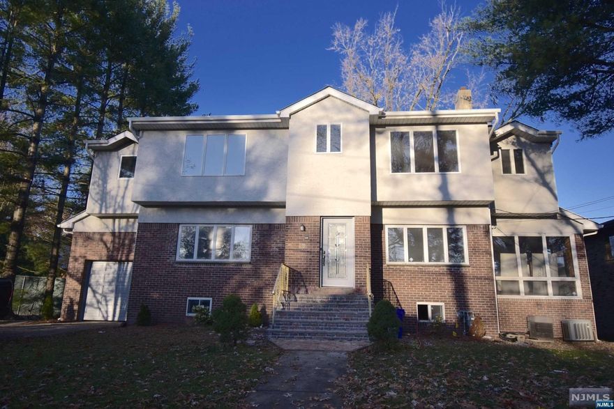 Welcome to this bright and sunny 5 bedroom colonial. The 1st floor features high ceilings,Renovated kitchen, living room, family room, and a Sun Room and 1/2 bath. The 2nd floor has a large master bedroom with walk-in closets and master bath, 3 additional bedrooms and a main bath and Laundry room. Basement is fully finished with two extra rooms, 1 Full Bath, play room. Features also include: Hardwood floors throughout, two zone central air, 1 car garage and more. Tenant is responsible for upkeep of lawn and snow removal. Require NTN report