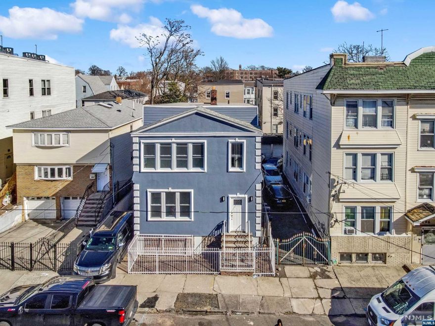 A completely renovated 2-Unit Investment property is now available for sale in Irvington. It holds 7 bedrooms, Bonus Room, 2full baths, private driveway and a detached 2-car Garage with backyard space. This property is completely enclosed. The unfinished basement is clean and covers the entire length of the house (full-sized basement) ready for you to add your own touch of adding value. The large bedrooms and common areas are great features for would-be tenants or family/friends of your own to enjoy within the same space. The bonus room is located on the first or second floor, depending on where your imagination may take you! The hardwood-vanilla floors run throughout the entire unit on both floors and are a beautiful compliment to both the kitchen, with large pantry, and bright spacious bathrooms. There are separate Hot Water Heaters and Boilers for both units. Your utilities are also separate which will make it easy for all future tenants paying for their own usage. Schedule NOW