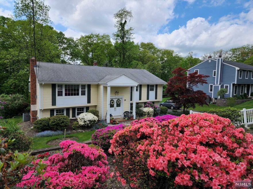 You will love coming home to this beautiful, updated Bi-level! Enter through the front door into a large foyer that is open to both levels. Go up the stairs & enter in to the LR with a gas fireplace that flows in to the DR with a garden window, sliders to the deck overlooking the back yard & is open to the Newly renovated kitchen with SS appliances, granite counters, tiled back splash, under cabinet lighting, a center Island & an abundance of cabinet space. There are 3 BR's & 2 full baths on the upper level while the lower level offers a large FR with a WB fireplace, access to the outdoor patio, a 4th BR, 1/2 bath, laundry & entry to the oversized heated garage. There are wood floors throughout the upper level, NEW laminate floors on the lower level, C/A, Sewer, nat. gas & plenty of storage including an attic with pull down stairs. Located on just under 1/2 an acre & situated on a quiet residential street, this great home is ready for you to add your own touches personal touches.