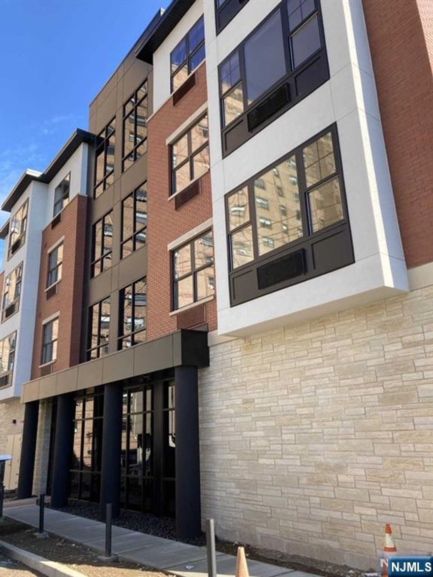 Newer exquisitely finished 21 unit elevator building. Perfect for commuters. Located on quiet private street. NYC express bus 1 block. Top of the line appliances and washer and dryer. No pets. This unit has a bedroom alcove area. Owner is a licensed RE broker.