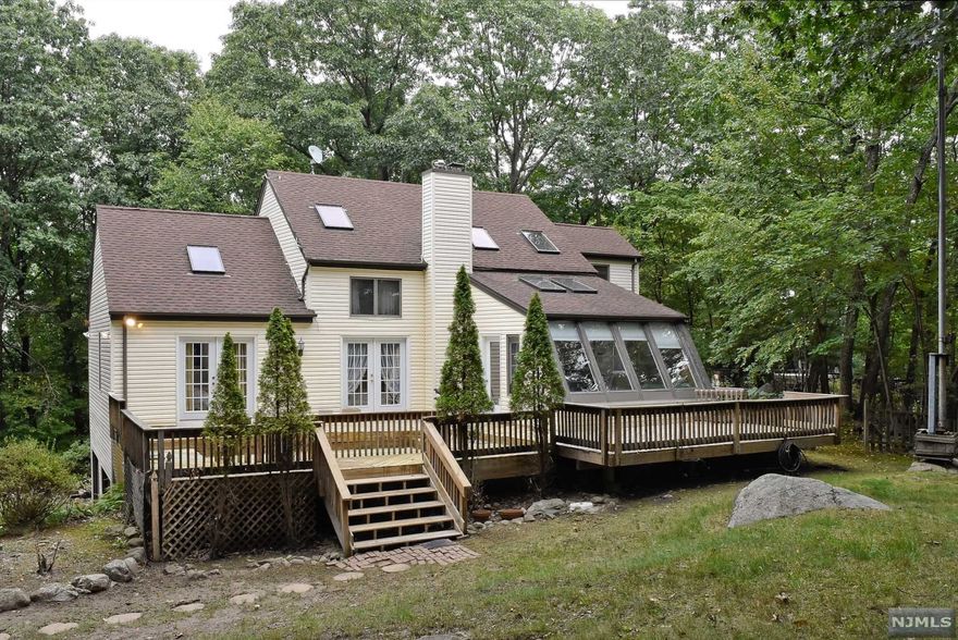 Beautiful custom home on cul-de-sac on .81 acres backed by wooded setting. Impressive entry foyer, 3 bedrooms, 3.5 baths, gourmet kitchen, cabinet organizers, tile floor, granite tops. Hardwood floors throughout. 1st floor master suite with bath and walk-in closet. Large dining room and living room, vaulted ceiling with skylights. French doors leading to 2-tier deck from master bedroom and living room. Solarium room on rear of home. 2nd level loft with 2 bedrooms and a bath, walk-in attic storage. Lower level laundry/utility with toilet. Large family room, 2 car garage and storage shed. Plenty of living space.Back on mrkt buyer could not get financing