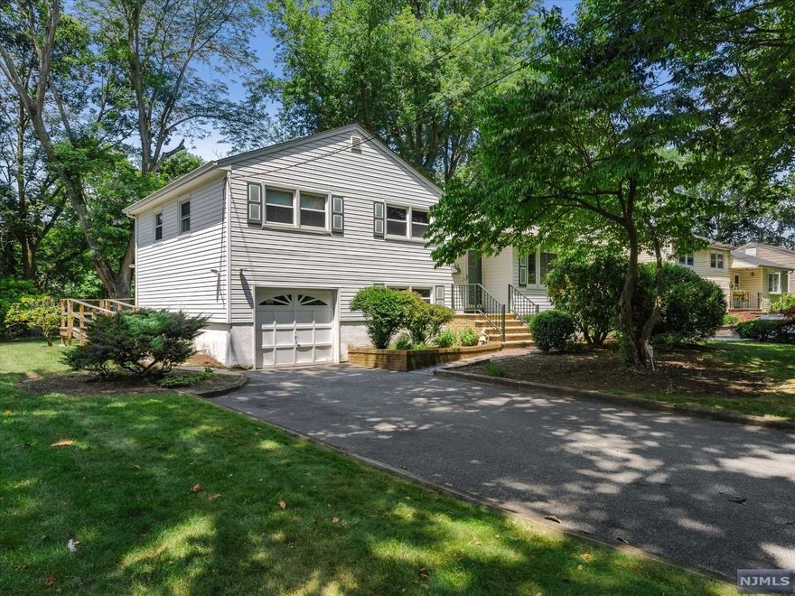 Well maintained 3 bedroom home tucked into a tree lined street. Beautiful hardwood floors grace the living and dining rooms accented with recessed lighting and newer windows. Updated kitchen offers 3 year young stainless steel appliances, granite counters, and lovely neutral tile backsplash with room for a breakfast table. A few steps down from the kitchen is newly refinished family room offering plenty of space for lounging, the perfect haven at the end of the day. Spacious deck accessed through dining room overlooks large property with special bonus of backing up to Sirianni Park. Generously sized basement with high ceilings offers great storage or additional room to grow. Oversized 1 1/2 car garage and central air too! Spacious, solid home with tremendous opportunity in terrific neighborhood. Home being sold "as is"