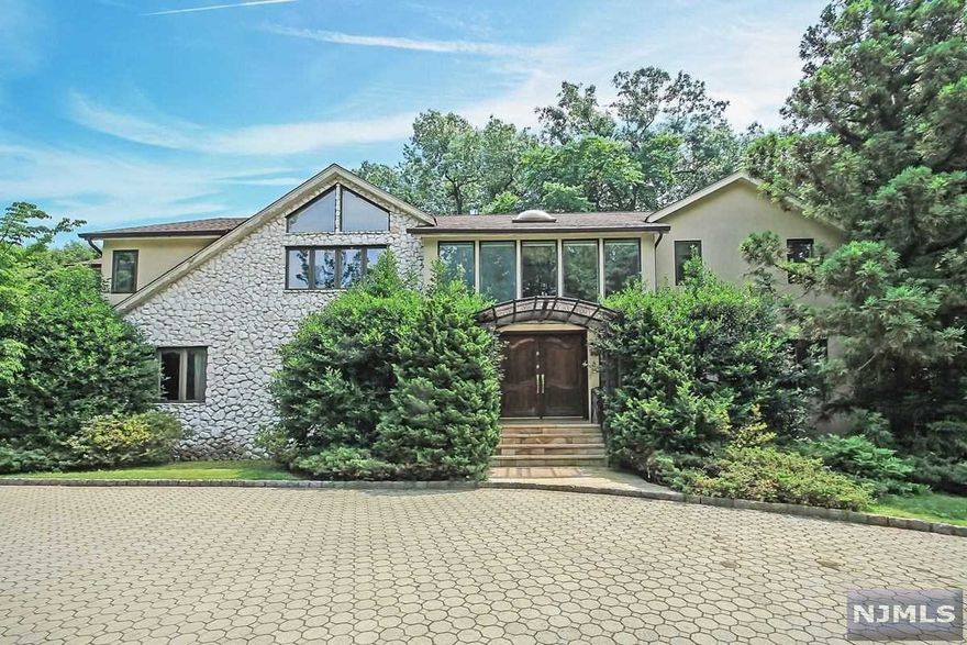 WONDERFUL CONTEMPORARY COLONIAL IN RIO VISTA, CRESSKILL, BEAUTIFULLY LANDSCAP3ED FOR THE UTMOST PRIVACY. THE GORGEOUOS POOL AND SPA ARE ALSO STRATEGICALLY PLACED AND LANDSCAPED TO ENSURE TOTAL PRIVACY. THE DESIGN OF THE LARGE RECTANGULAR ROOMS MAKE FOR EASY DECOR. THERE ARE BEAUTIFUL HAND CARVED SOLID WOOD DOORS THROUGHOUT. THE FIRST FLOOR OFFERS DRAMATIC 2 STORY ENTRY FOYER & FAMILY ROOM WITH FIREPLACE; DOUBLE CURVED STAIRCASE; SUNKEN FORMAL LIVING ROOM AND MEDIA ROOM; GUEST ROOM WITH FULL BATH; POWDER ROOM; MODERN EAT-IN REMODELED KITCHEN; LARGE REAR DECK. THE SECOND LEVEL HAS MASTER SUITE WITH BATH PLUS 3 ADDITIONAL BEDROOM S AND 2 BATHS. FULLY FINISHED BASEMENT HAS FULL BATH, CUSTOM MADE RUSSIAN STYLE SAUNA AND CEDAR CLOSET. NEW STUCCO RESURFACING. JUST A SHORT DISTANCE FROM NEW YORK CITY THIS HOME IS A TRUE OASIS!