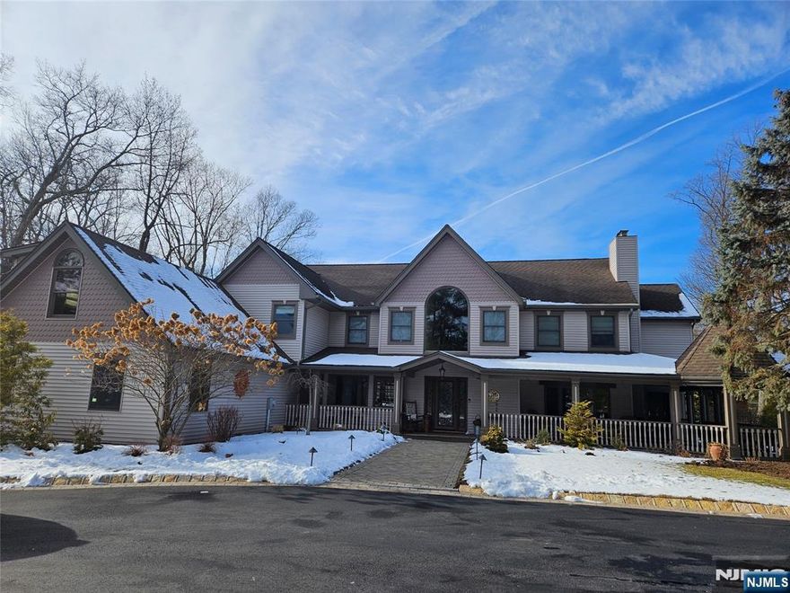 Great location! Welcome to this beautiful over 4800sf custom colonial on .96 acres which is backed by an additional 1.6 acre private wooded lot. (Saddle River-See notes below) A welcoming lemonade wrap around porch w/ gazebo opens to the foyer which is flanked by a cozy living room and spacious dining room. Oak flooring in both rooms. The kitchen flows seamlessly into the sun-filled great room with Australian cypress flooring and large windows. There is a 1st floor Bedroom/Office with mahogany flooring and a full bath. Also on the main floor is a powder room, Mud room, which leads to a 4 car heated garage with 10 ft ceilings and no columns. Two staircases take you to the 2nd floor which offers 4 bedrooms, 2 full baths, and a primary ensuite with 2 large dressing rooms and walk out balcony. Laundry is also on the 2nd floor. Lowe level features office, full bath, large entertainment room with built in bar, exercise rm. Double doors exit to lower patio. An upper patio features a full outdoor kitchen, and freestanding bar with full electric. There are 3 rear door entrances to the patios. Radiant heat in the Great Room, kitchen and all the bathrooms. The circular driveway is new asphalt with Belgian block. A large pond with 3 waterfalls offers complete privacy for the front of the house. Yard is custom landscaped. ***Rear lot in Saddle River, taxes $1772.28, included. Block 1202/Lot 13, which is only accessed via WCL side is included in the Sale.