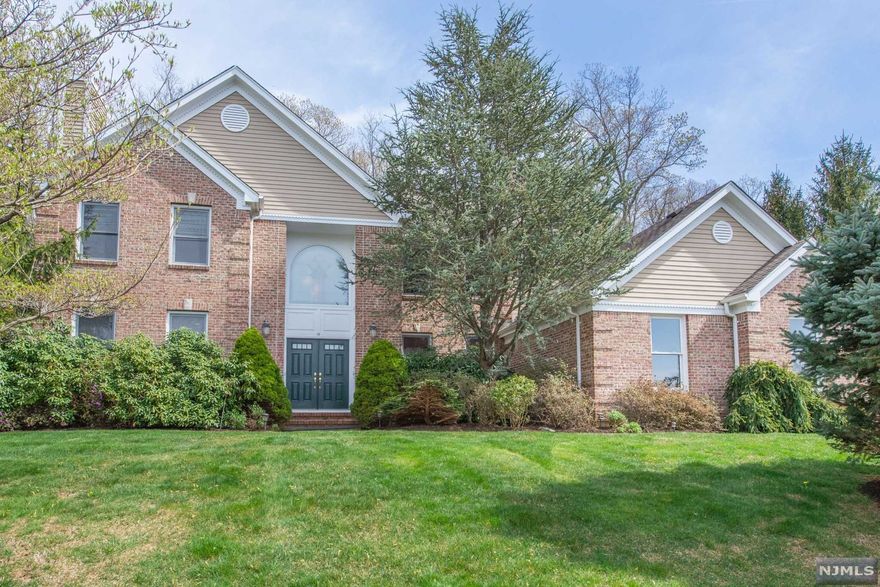 Stately Colonial, Understated Elegance! Nestled in one of Denville's most desirable neighborhoods, this home offers an upscale lifestyle on a quiet Cul-De-Sac. Prominently set on a large, level lot backed against a protected wooded area. Bright, open floor plan. Many high end features throughout. A grand home accented w/architectural details; high ceilings, wainscoting, curved walls & moldings. A showcase home with several customizations! Paramount Homes, Georgetown I floorplan with enlarged layout & added square footage give this home an edge. Updated kitchen w/coriander countertops & gourmet SS appliances. Cathedral ceilings & floor to ceiling windows in Family Room. Formal Dining & Living Rooms bookend the striking 2 story Foyer w/custom made stained glass window & chandeliers. Entertain with Flair! Extra bdrm/office on 1st floor. Upstairs, the primary suite features a large bath, 2 walk-in closets & sitting area. 3 more bdrms & bath.