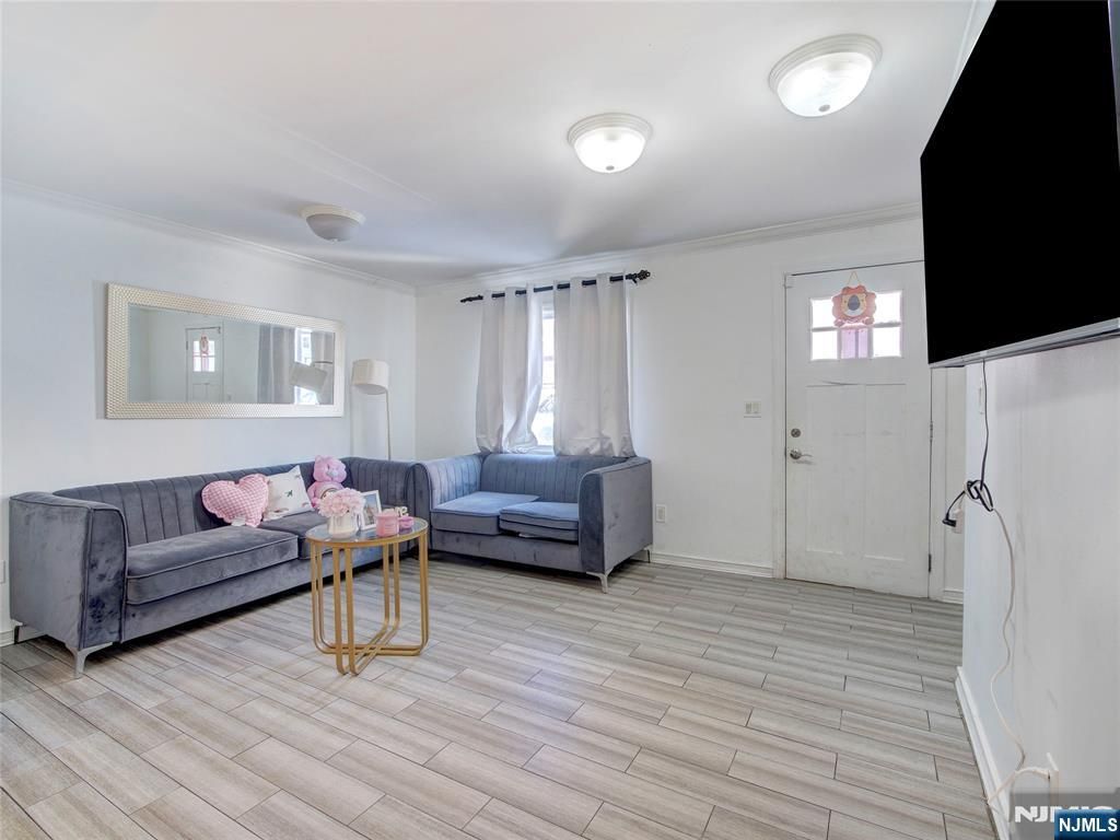 Photo of 118 Carlisle Avenue, Paterson, NJ 07501 (MLS # 26006728)